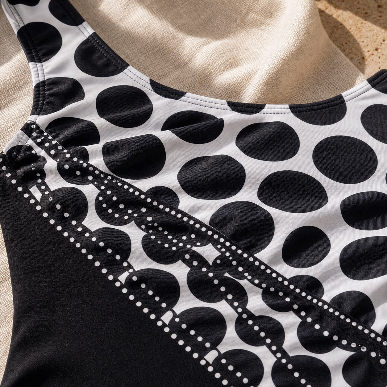Soravea Mosaic black and white patchwork swimsuit fabric close-up