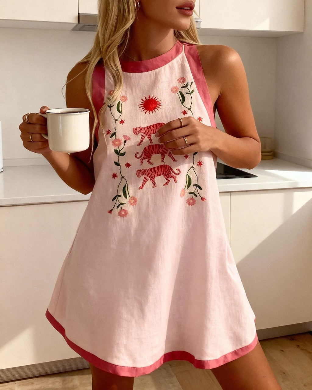 Tiger Bloom Dress in soft pink with red tiger and floral embroidery, featuring contrast pink trim and sleeveless design.