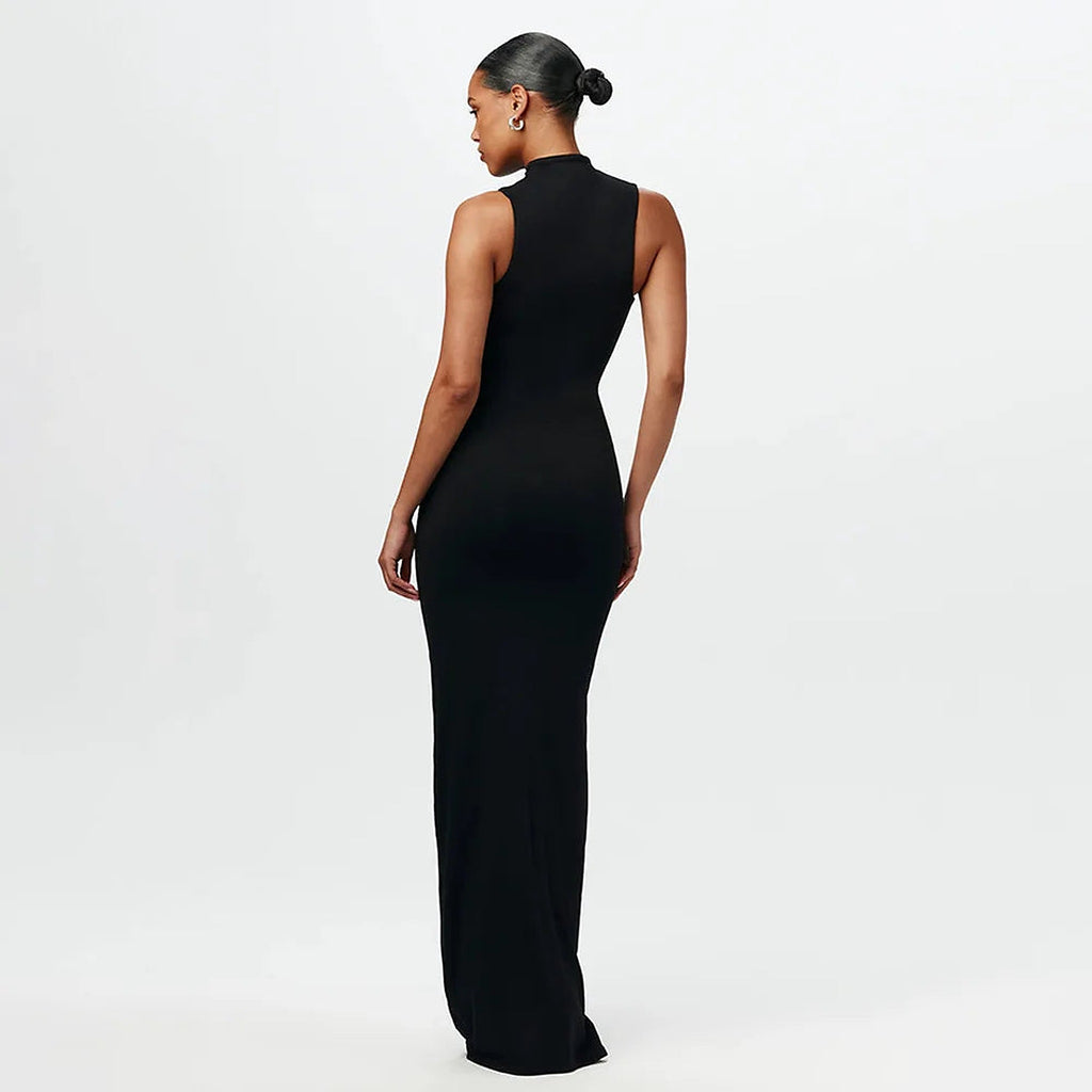 Black sleeveless Maia bikini dress with high neckline, shown from back view on model against white background.