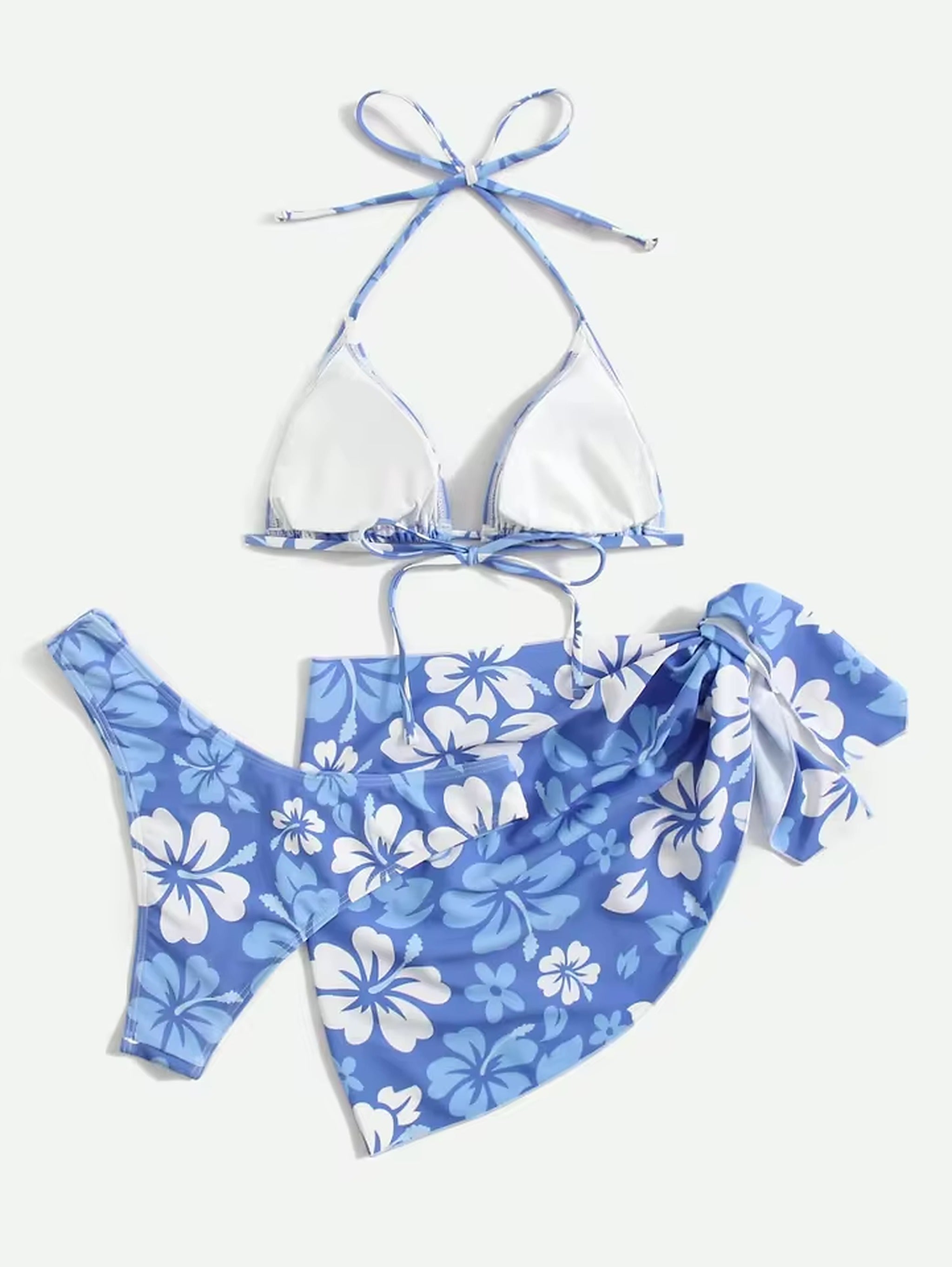 White halter bikini top with blue floral print swim shorts and adjustable ties