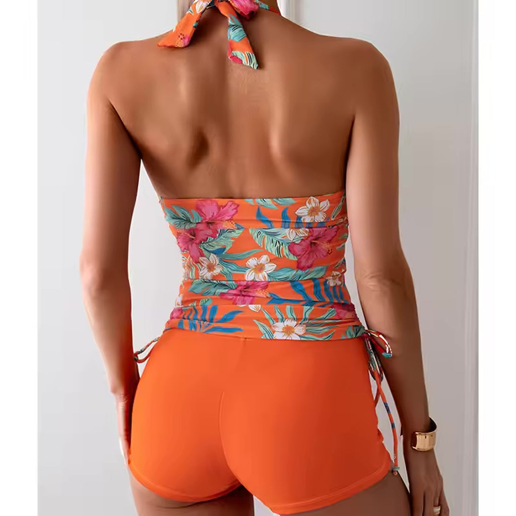 Flaunfit orange floral halter bikini with tropical print bandeau top and solid shorts, back view.