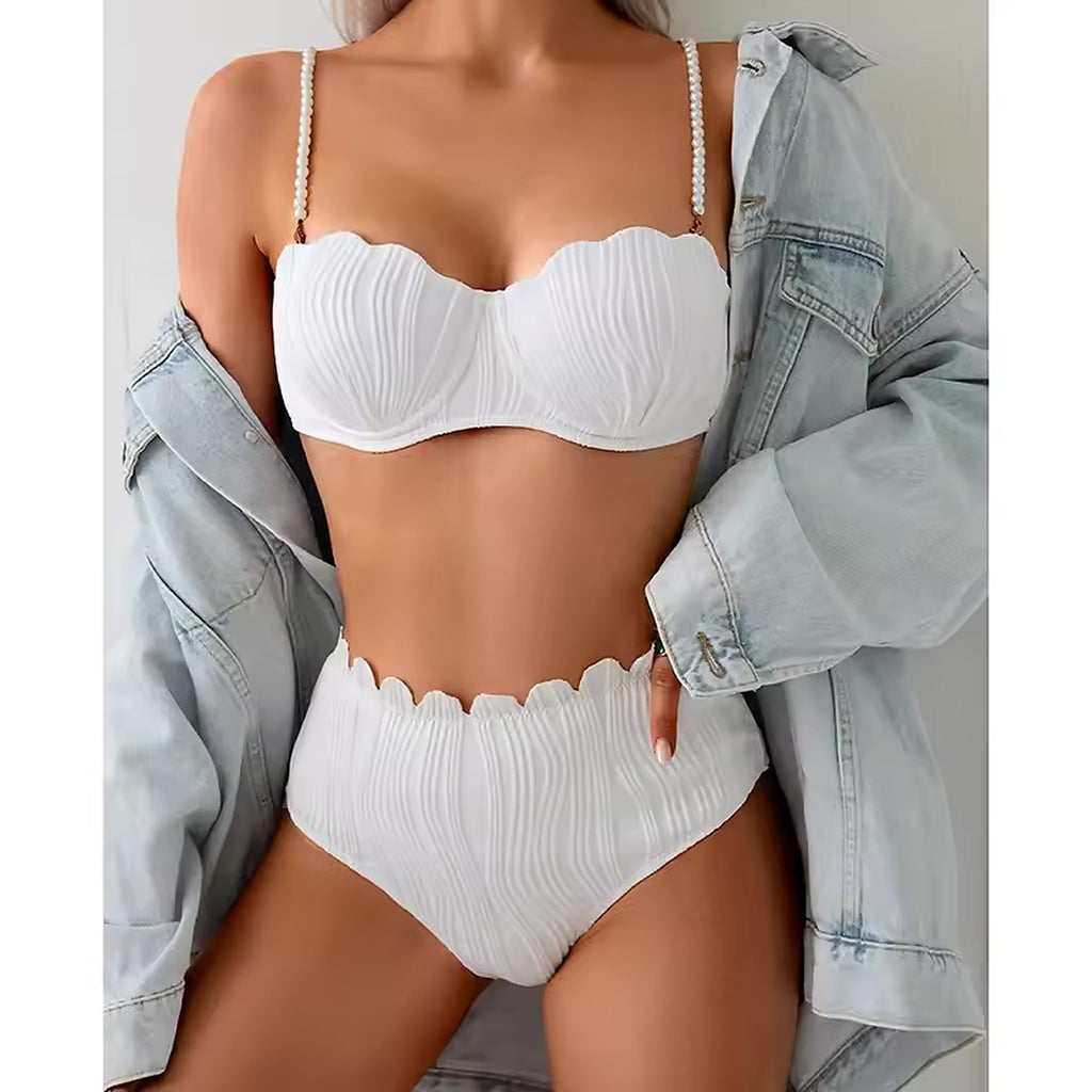 White ribbed bikini with pearl-beaded straps and scalloped edges, styled with denim jacket
