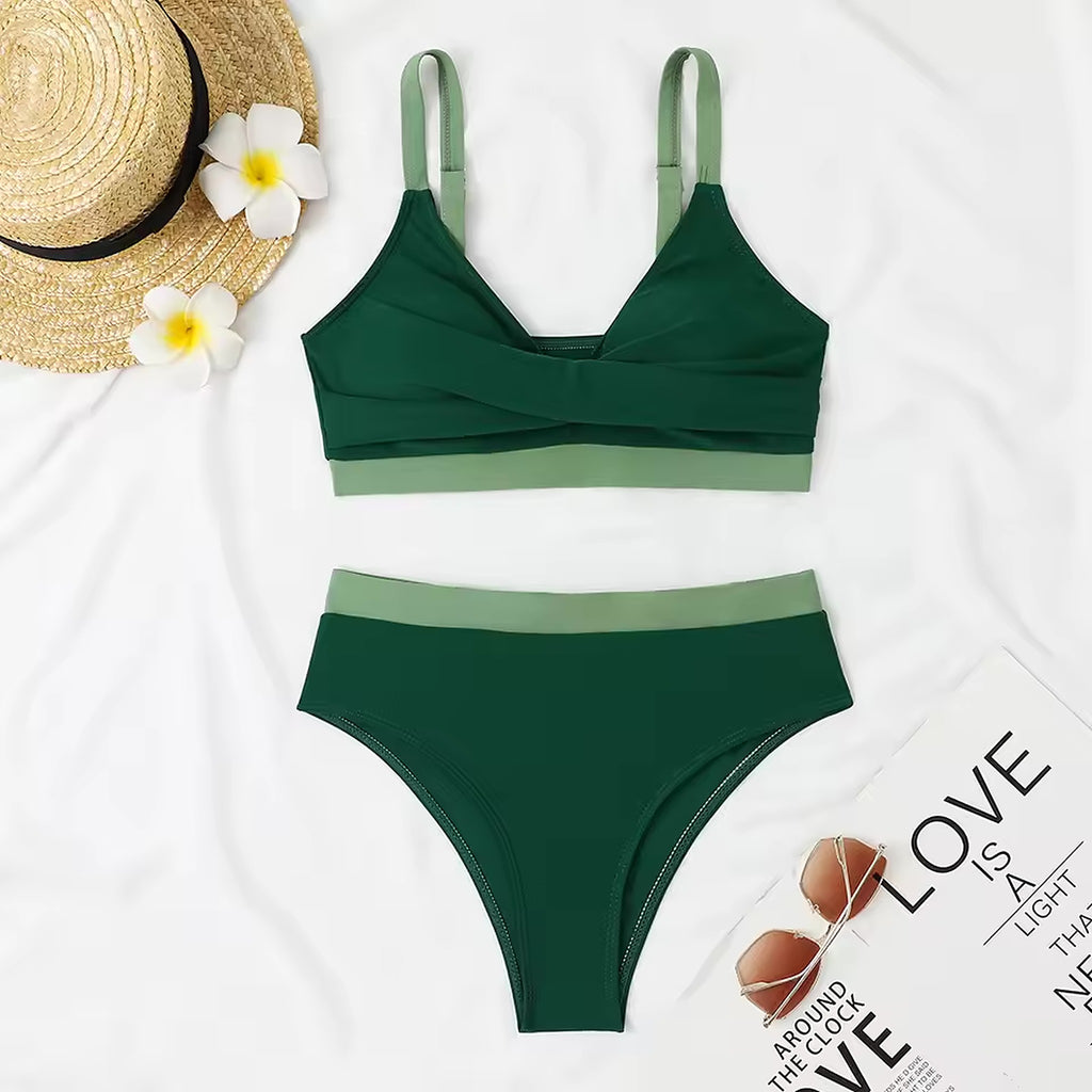 # Alt Text:

Moana Drift bikini in forest green with sage green accents, featuring a twisted bandeau top and high-waisted