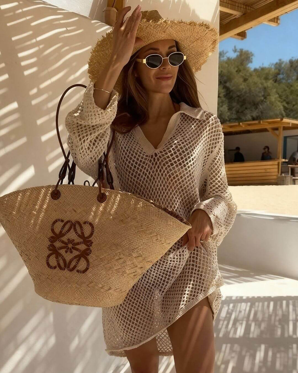 White crochet bikini cover-up with V-neckline styled at sunny poolside retreat