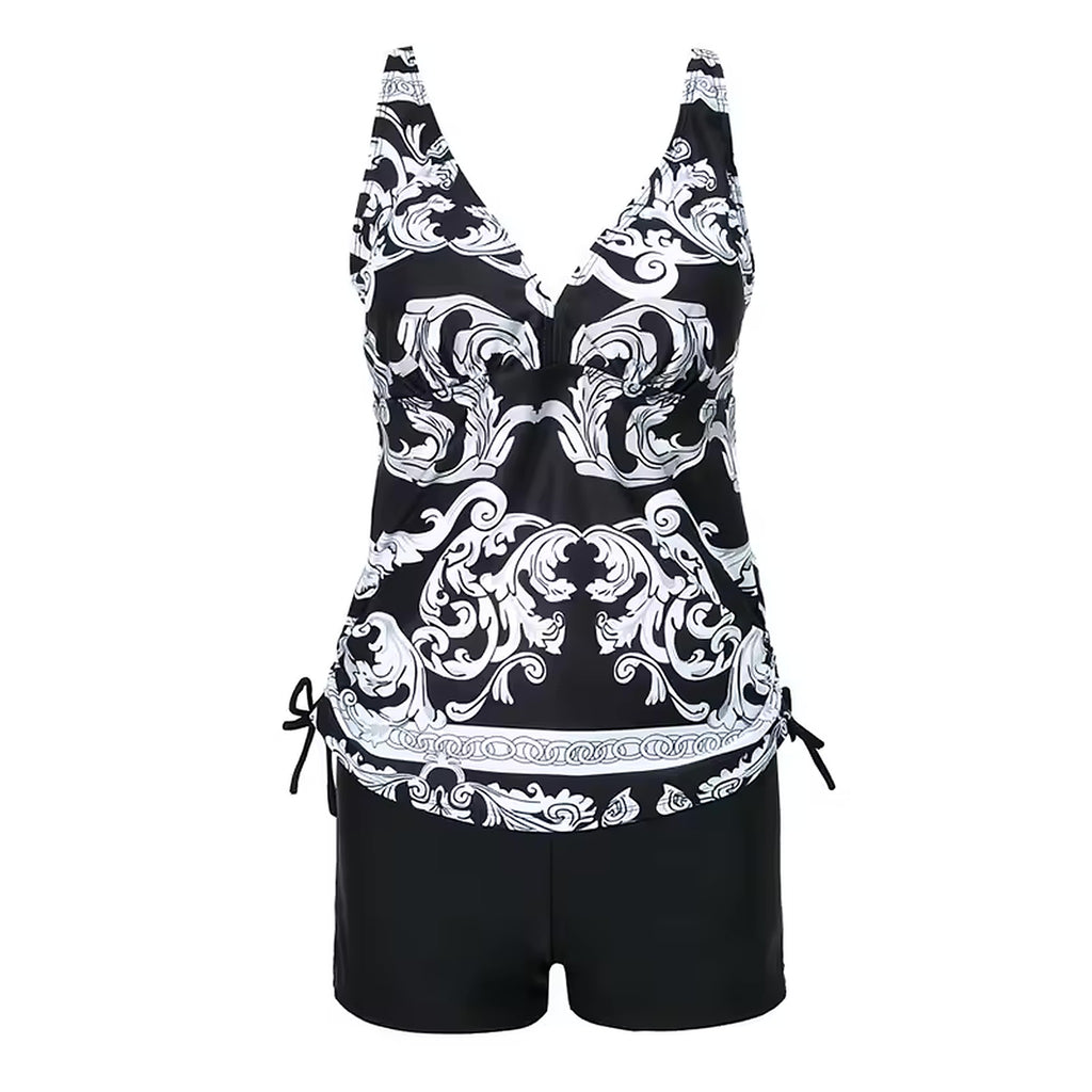 Black and white baroque patterned tankini top with coordinating black shorts, featuring adjustable side ties and supportive